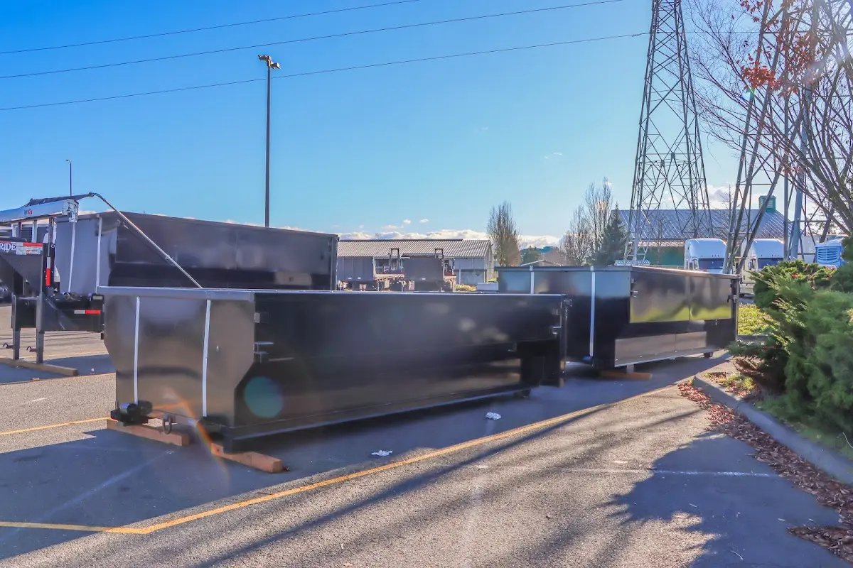 Roll-off dumpster ready for waste disposal at job site for Demolition Dumpster Rental in Woodhaven